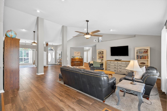 living room with hardwood / wood-style floors, high vaulted ceiling, and ceiling fan