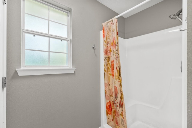 bathroom featuring walk in shower