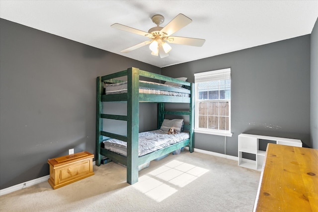 bedroom featuring ceiling fan and light colored carpet