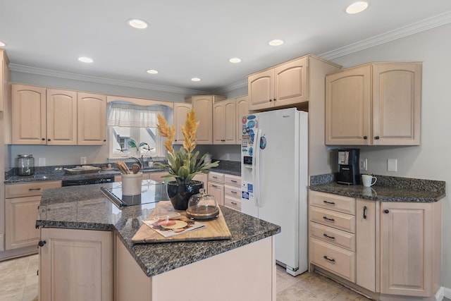 kitchen featuring light brown cabinetry, ornamental molding, dark stone counters, white refrigerator with ice dispenser, and a center island