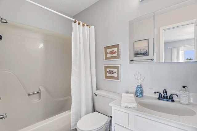 full bathroom with vanity, shower / bath combination with curtain, a textured ceiling, and toilet