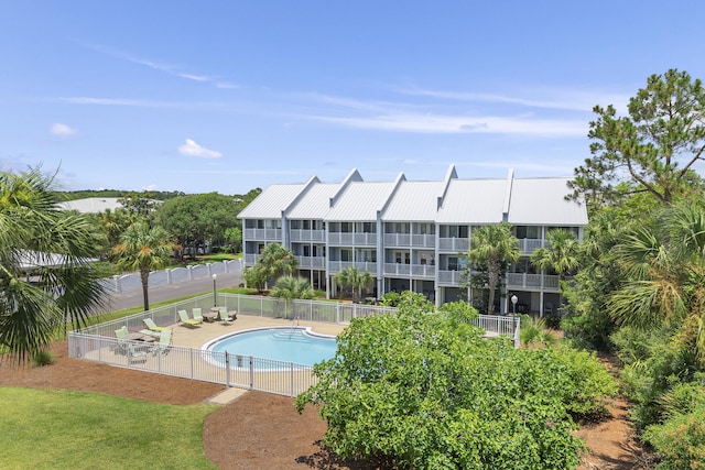 view of swimming pool featuring a patio area