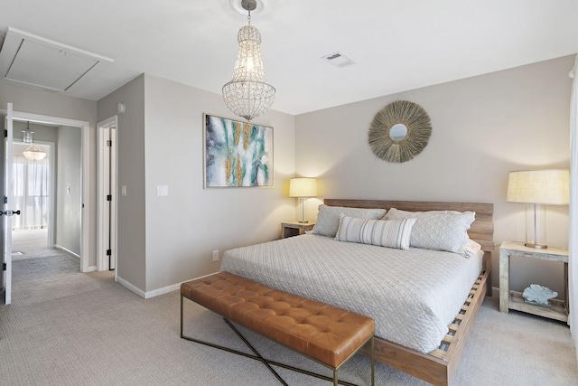 carpeted bedroom featuring a notable chandelier