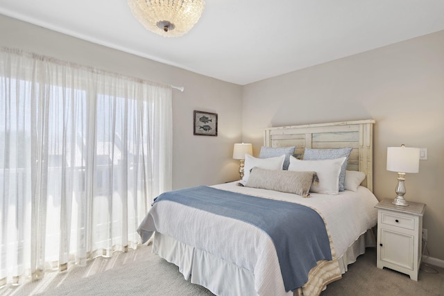 bedroom with light colored carpet