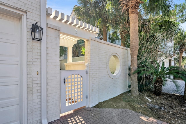 doorway to property with a pergola