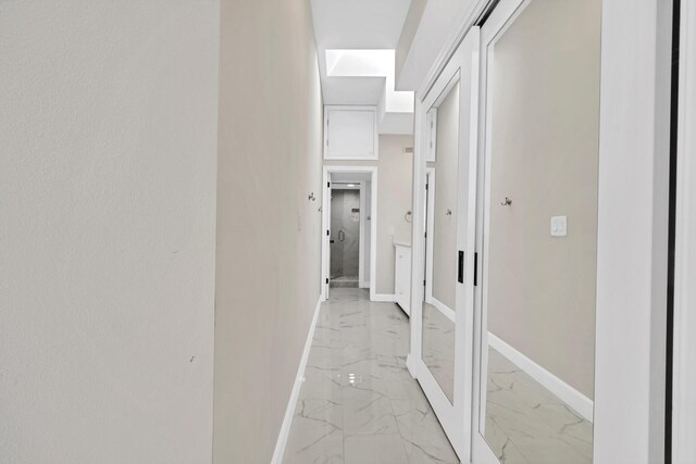 hallway with light tile flooring