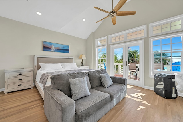 bedroom featuring ceiling fan, light hardwood / wood-style floors, french doors, access to outside, and high vaulted ceiling