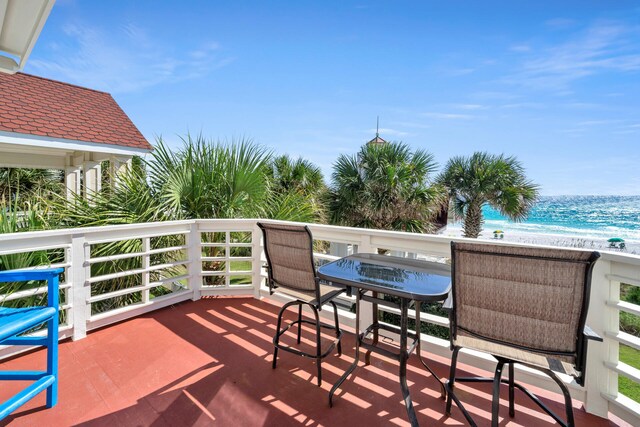 balcony featuring a water view