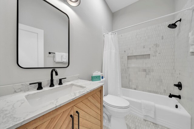 full bathroom with tile flooring, toilet, shower / bathtub combination with curtain, and vanity