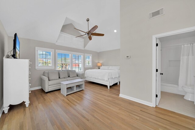 tiled bedroom with ceiling fan and ensuite bathroom