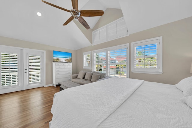 bedroom featuring high vaulted ceiling, hardwood / wood-style flooring, ceiling fan, and access to exterior