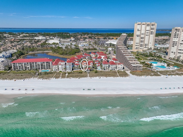 drone / aerial view featuring a view of the beach and a water view