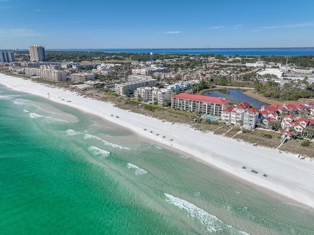 birds eye view of property featuring a view of the beach and a water view