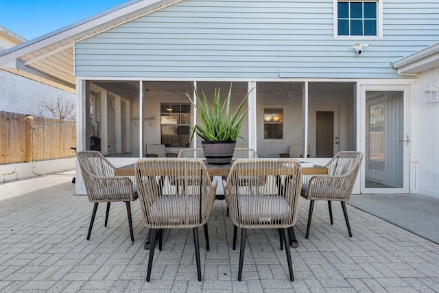 view of patio / terrace featuring a sunroom