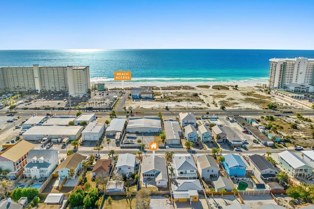 bird's eye view featuring a view of the beach and a water view