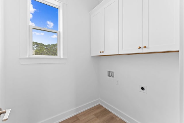 laundry room featuring hookup for an electric dryer, cabinets, wood-type flooring, and washer hookup