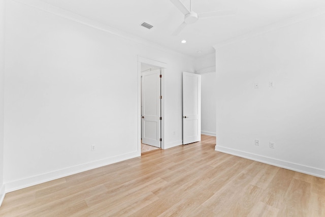 spare room with ceiling fan, light hardwood / wood-style flooring, and ornamental molding