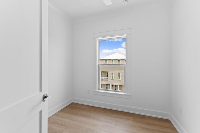 empty room with light hardwood / wood-style flooring