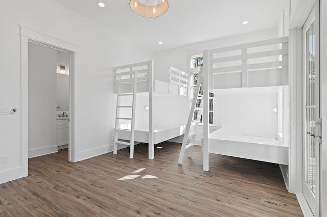 unfurnished bedroom featuring dark hardwood / wood-style floors