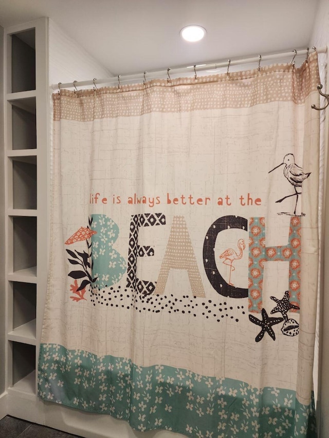 bathroom featuring tile patterned flooring, built in features, and a shower with shower curtain