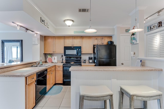 kitchen featuring kitchen peninsula, sink, black appliances, light tile patterned floors, and decorative light fixtures