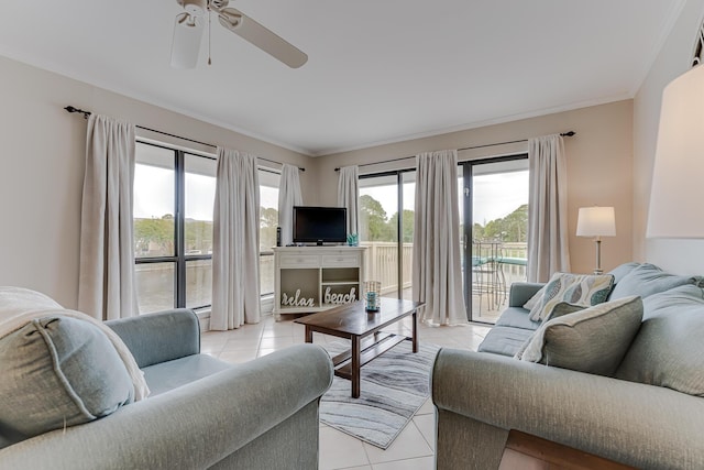 living room featuring ceiling fan, light tile patterned floors, and ornamental molding