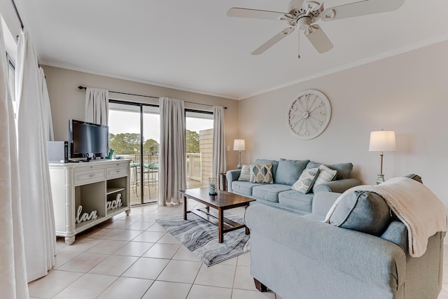 tiled living room with ceiling fan and crown molding