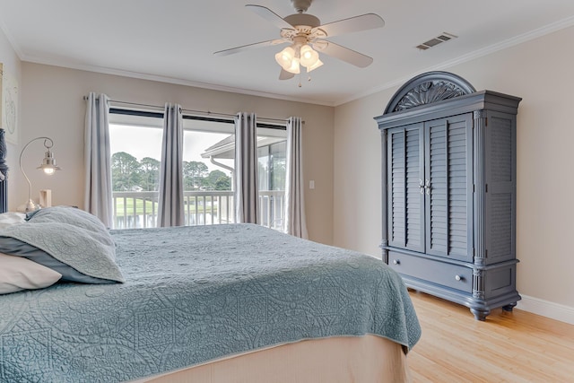 bedroom featuring hardwood / wood-style floors, ceiling fan, ornamental molding, and access to outside