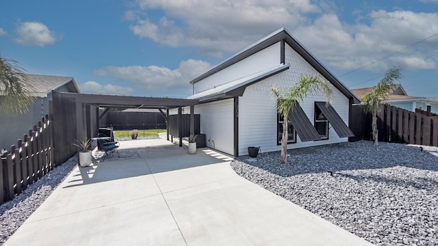 view of side of property featuring a patio