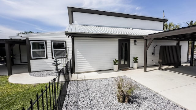 view of front of home with a carport