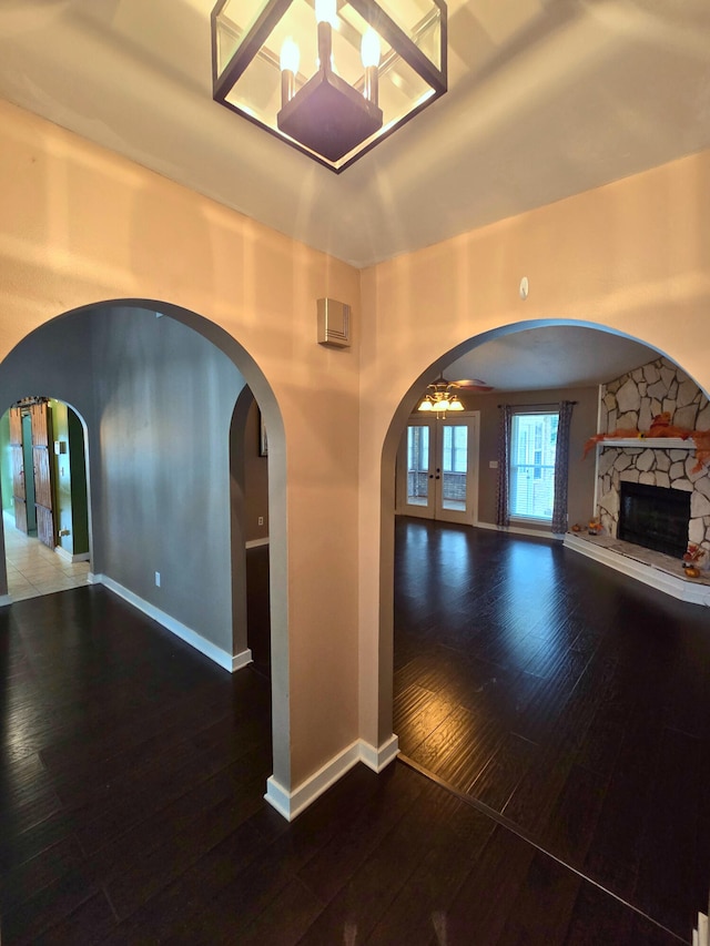 hallway featuring wood-type flooring and french doors