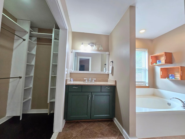 bathroom with vanity and a tub to relax in