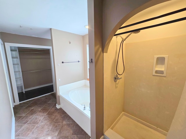 bathroom with separate shower and tub