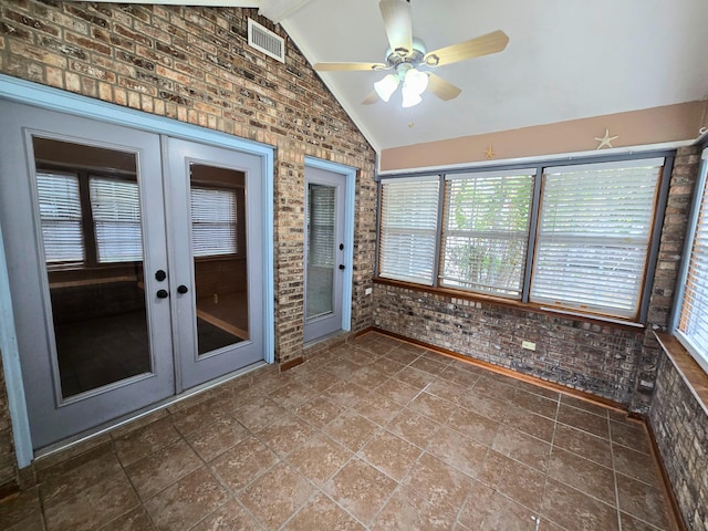 unfurnished sunroom with vaulted ceiling with beams, ceiling fan, and french doors