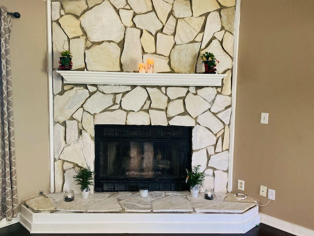 room details featuring a stone fireplace