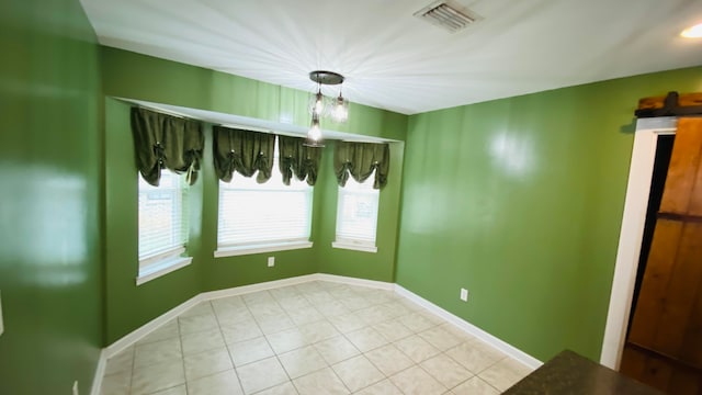 empty room with light tile patterned floors