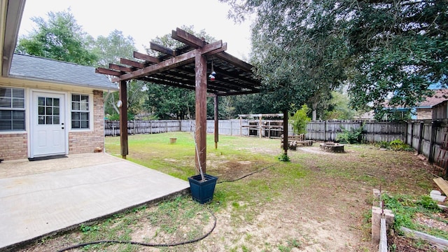 view of yard with a pergola, a patio, and a fire pit