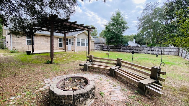 view of yard featuring a pergola and an outdoor fire pit