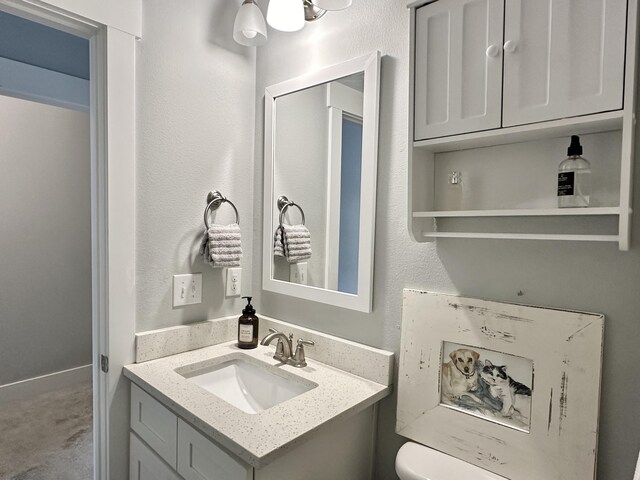 bathroom with vanity and toilet