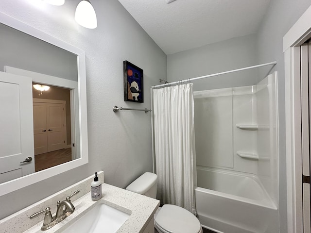 full bathroom featuring vanity, shower / tub combo, a textured ceiling, and toilet