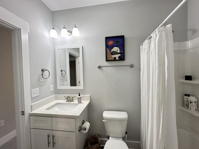 full bathroom with vanity, toilet, and shower / bath combo with shower curtain