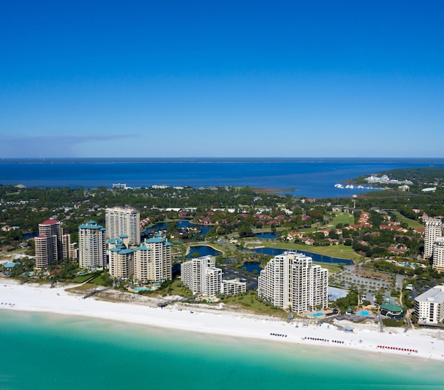 drone / aerial view featuring a view of the beach and a water view