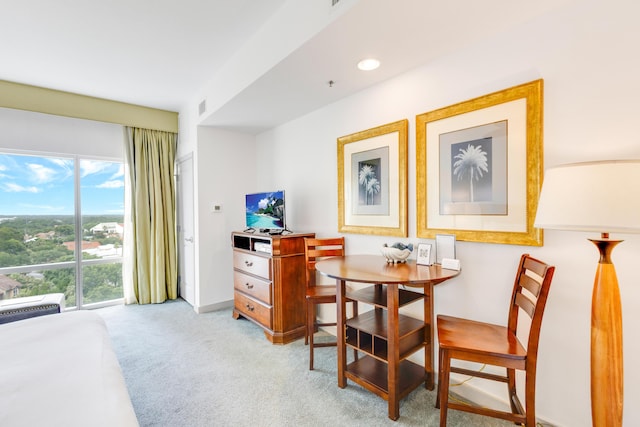 dining space featuring light colored carpet