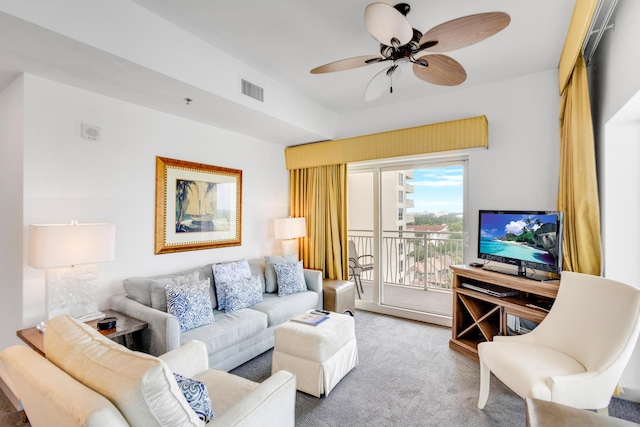 living room featuring ceiling fan and carpet floors