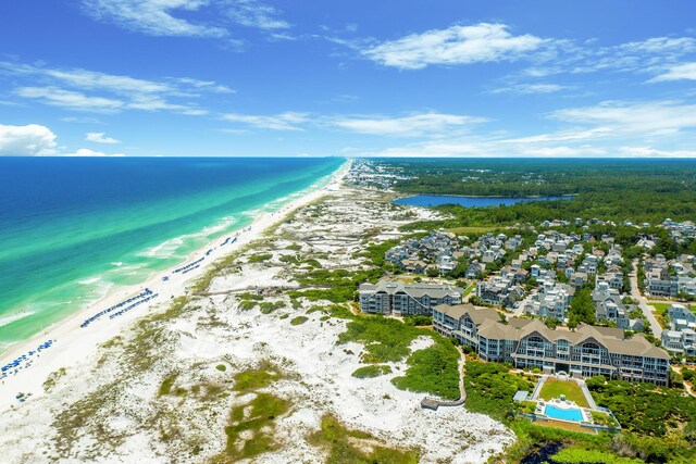 drone / aerial view with a view of the beach and a water view