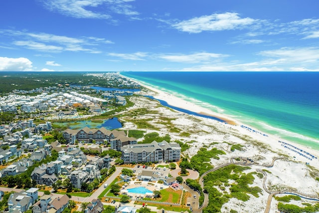 birds eye view of property with a view of the beach and a water view