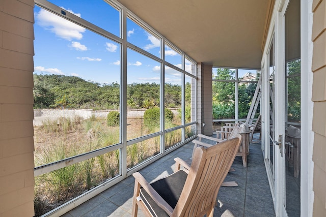37 S Compass Point Way Unit 107, Inlet Beach, FL 32461 - sunroom featuring tile patterned floors