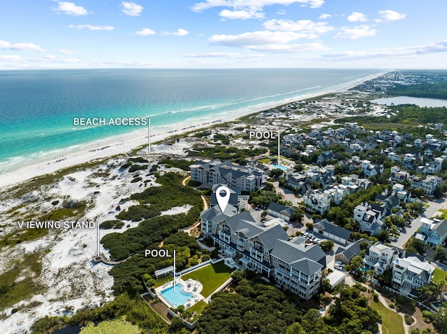 aerial view featuring a view of the beach and a water view