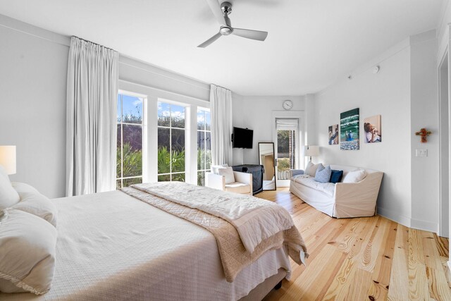 bedroom featuring wood finished floors and a ceiling fan