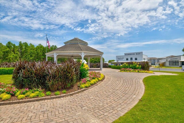 view of property's community featuring a gazebo and a lawn